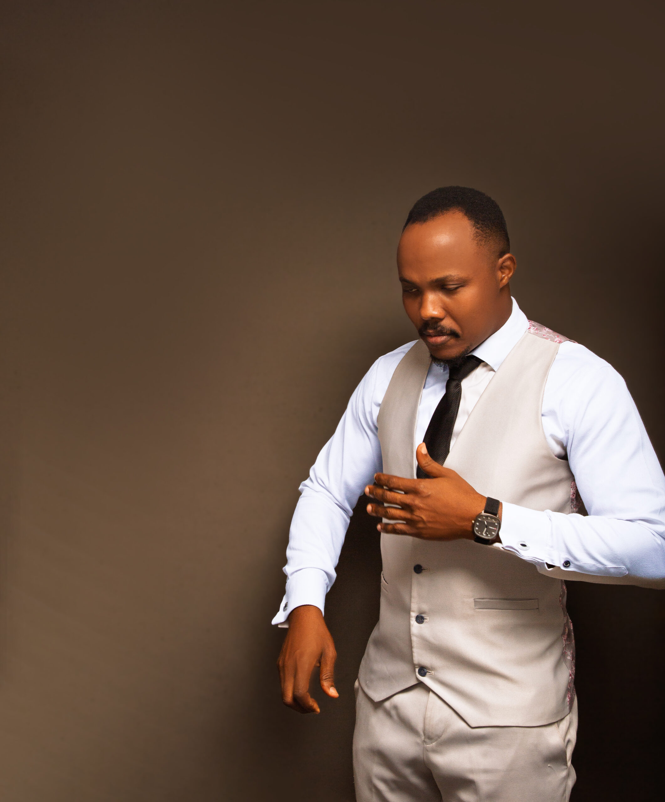 Taiwo Orbs, brand messaging strategist, in a light waistcoat and tie